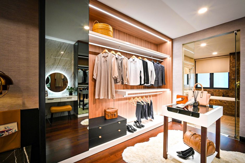 Luxurious custom walk-in closet with modern shelving and lighting